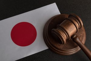 Judge wooden gavel and flag of Japan. Law and justice. Legality concept